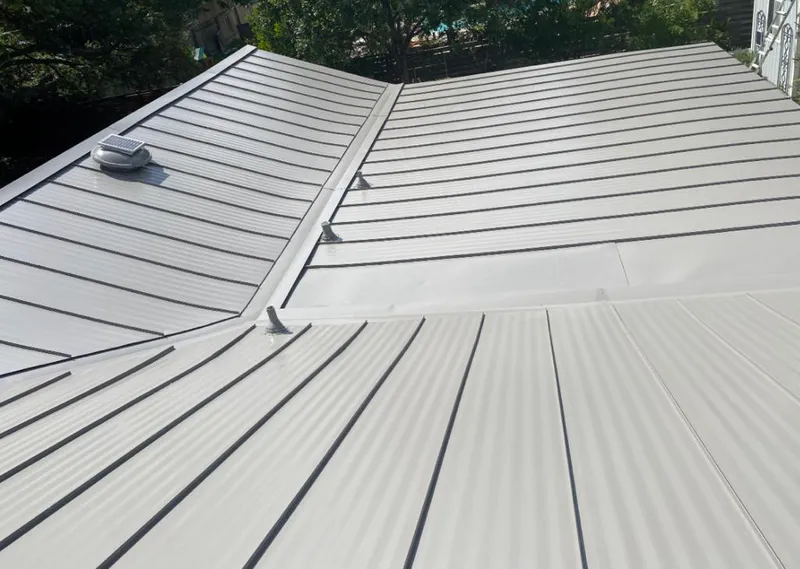 Solar attic fan installed on a metal roof for Roof Ventilation in London Grove